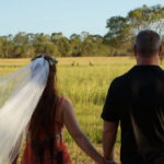 The wandering wedding dress diary with tegan marshall becoming engaged photo with tegan mathews holding hands with Clark and kangaroos