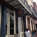 The wandering wedding dress diary usa new orleans tegan marshall becoming engaged at the French Market Inn front door with tegan mathews