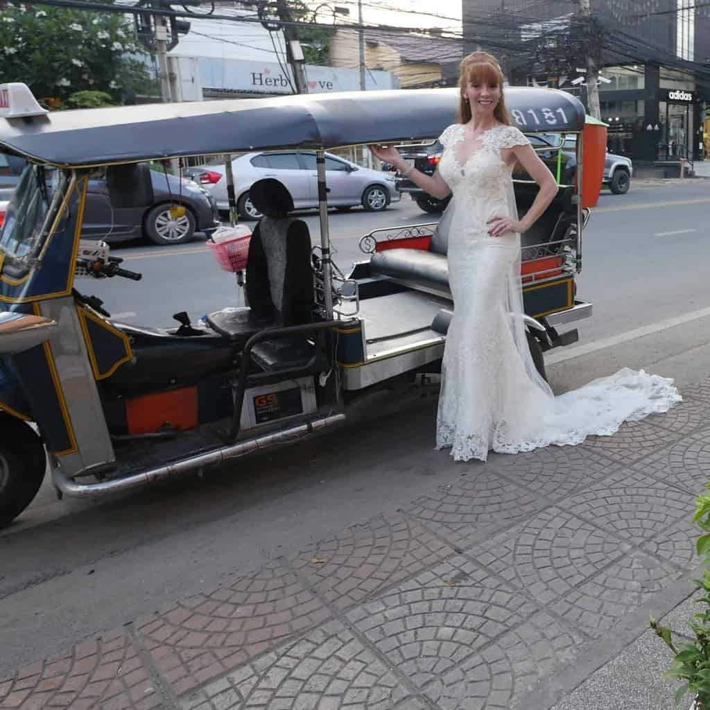 Tegan Marshall Catching A Tuk Tuk In Thailand In The Wandering Wedding Dress